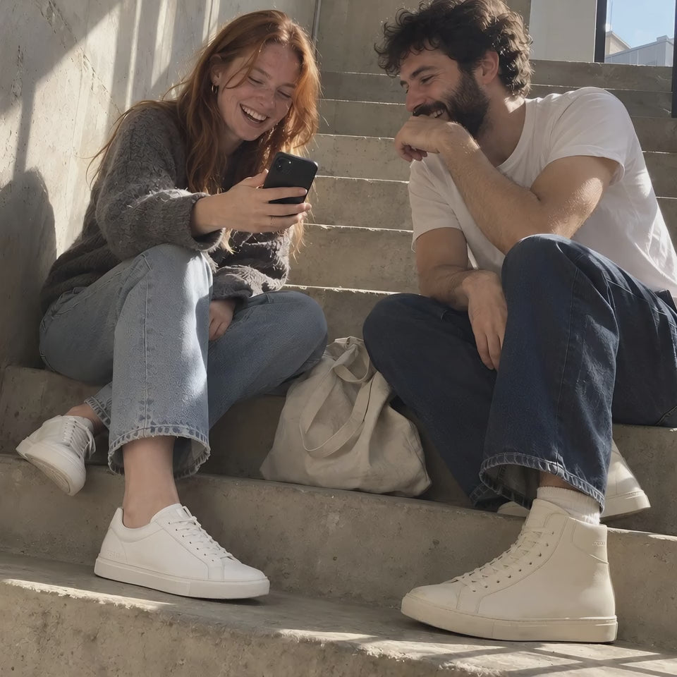 Two friends on a sunny stair, in white TREAD Court and bone TREAD Court High
